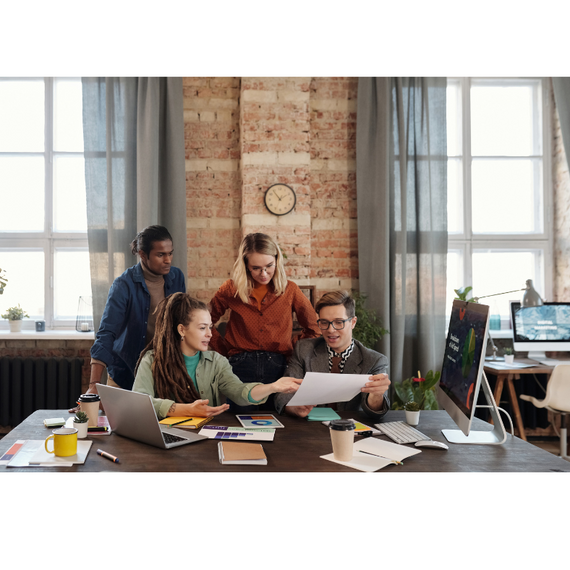 Four individuals having a business meeting in a professional setting