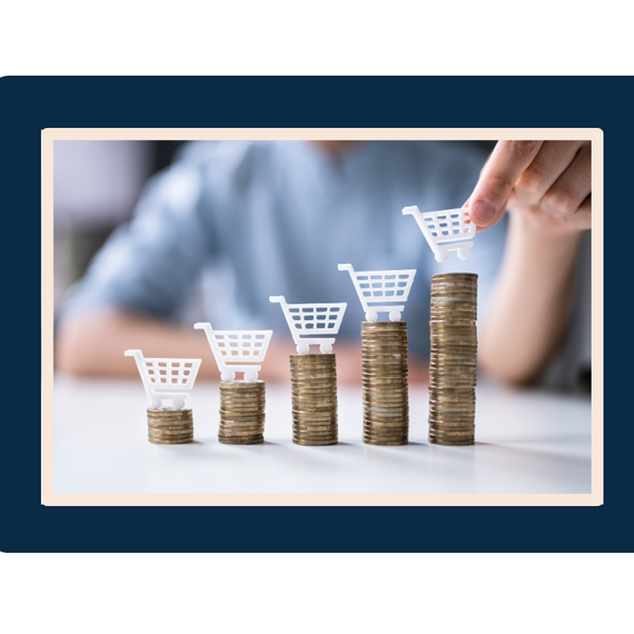Piles of coins with shopping carts on top representing ecommerce marketing boost benefits